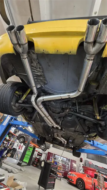 Custom stainless steel quad exhaust system fabricated and welded on a BMW at Car Fix Mechanic, Clondalkin